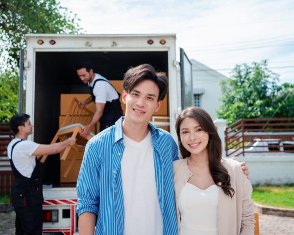 asian-couple-check-while-unloading-boxes-and-furniture-from-a-pickup-truck-1