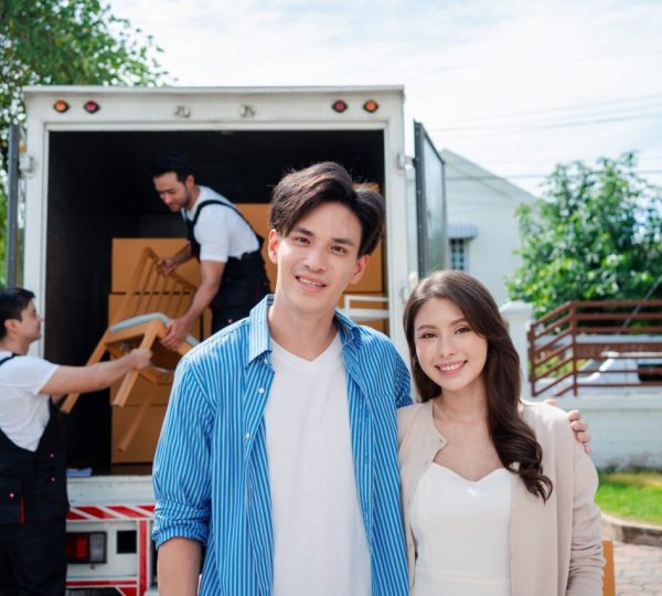 asian-couple-check-while-unloading-boxes-and-furniture-from-a-pickup-truck-1